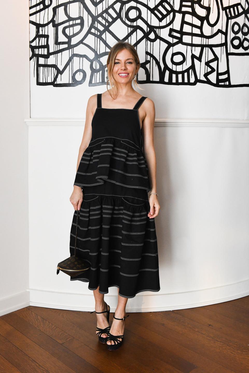 <h1 class="title">Sienna Miller supporting her close friend, Poppy Delevingne, decked out in Ilene Joy's pearl drop earrings.</h1><cite class="credit">Photo: Joe Schildhorn / BFA</cite>