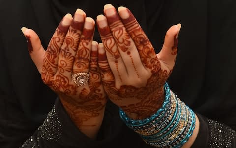 A Pakistani Muslim worshipper prays to mark Eid al-Fitr at the Badshahi Mosque in Lahore last year - Credit: Arif Ali/AFP