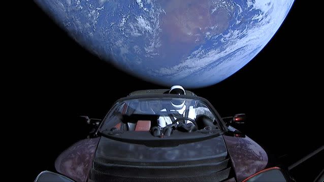 The  Tesla roadster launched from the Falcon Heavy rocket with a dummy driver named 'Starman' heads towards Mars. Source: Getty