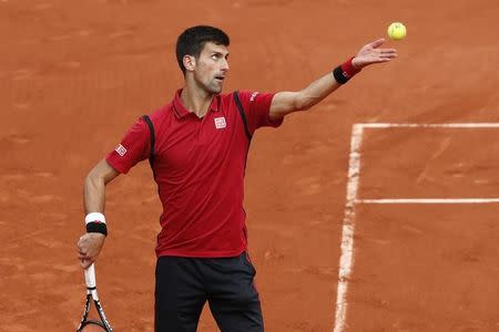 Tennis - French Open - Roland Garros - Novak Djokovic of Serbia vs Yen-Hsun Lu of Taiwan - Paris, France - 24/05/16. Novak Djokovic serves the ball. REUTERS/Benoit Tessier