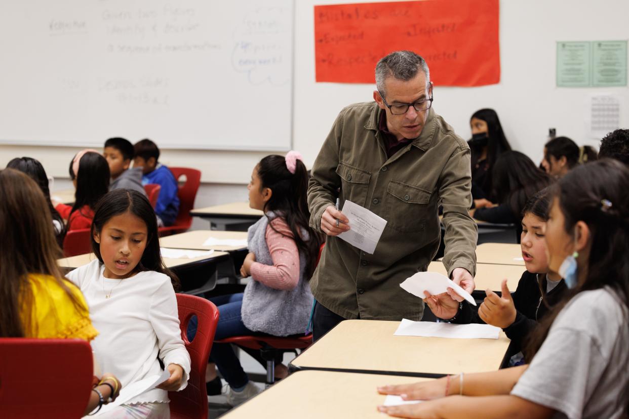 Teacher Josh Goldstein preps Young Writer's Academy students for a special reading of their work at Cesar E. Chavez Elementary School on May 18.