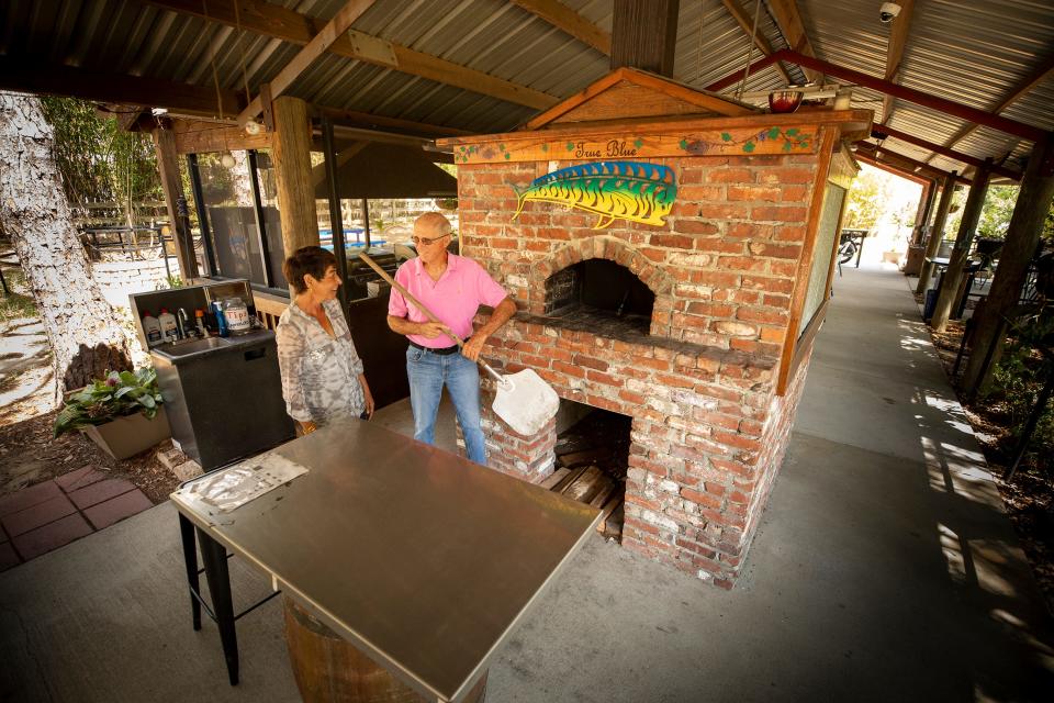 Howard and Fatima Gill have a brick pizza oven at their True Blue Winery in Davenport Fl. Tuesday May 17,  2022.  ERNST PETERS/ THE LEDGER