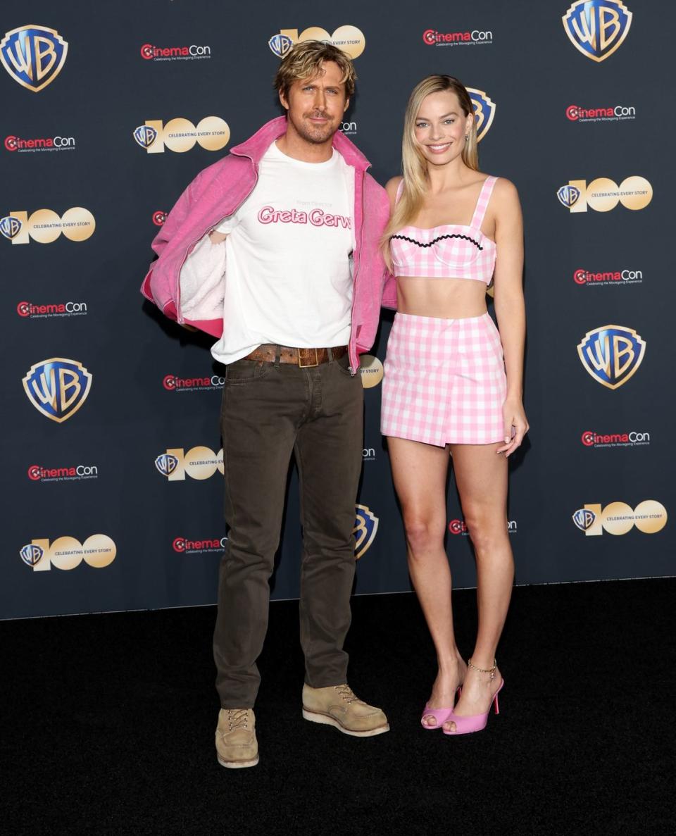 las vegas, nevada april 25 ryan gosling l and margot robbie pose for photos as they promote the upcoming film barbie during the warner bros pictures presentation at the colosseum at caesars palace during cinemacon, the official convention of the national association of theatre owners, on april 25, 2023, in las vegas, nevada photo by gabe ginsberggetty images