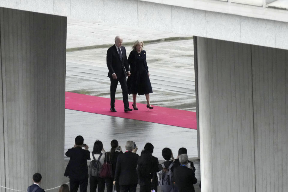 U.S. President Joe Biden, left, and first lady Jill Biden, arrive at the Peace Memorial Park, as part of the G7 Leaders' Summit in Hiroshima, western Japan, Friday, May 19, 2023.(Kyodo News via AP)