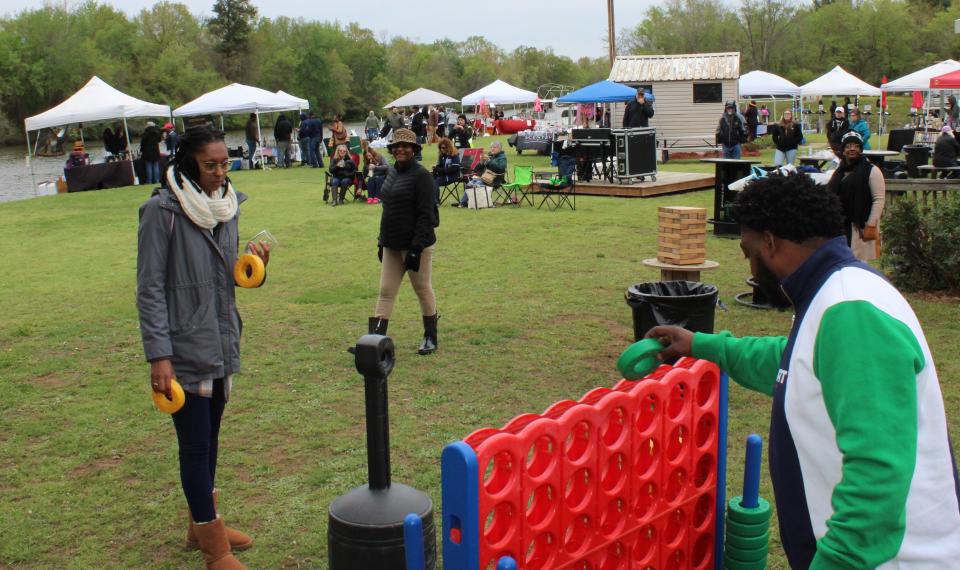 Appomattox River Wine Festival attendees play Connect Four in Prince George, Va. on April 8, 2023.