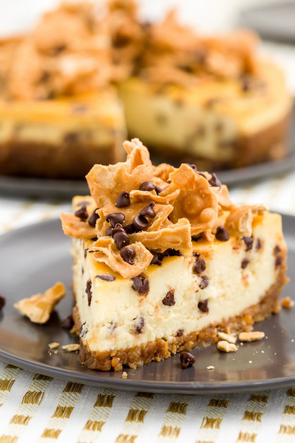 <p>Studded with mini chocolate chips and topped with pieces of waffle cones, this Italian-style cheesecake is insane.</p><p>Get the recipe from <a href="https://www.delish.com/cooking/recipe-ideas/recipes/a43604/cannoli-cheesecake-recipe/" rel="nofollow noopener" target="_blank" data-ylk="slk:Delish;elm:context_link;itc:0;sec:content-canvas" class="link ">Delish</a>. </p>