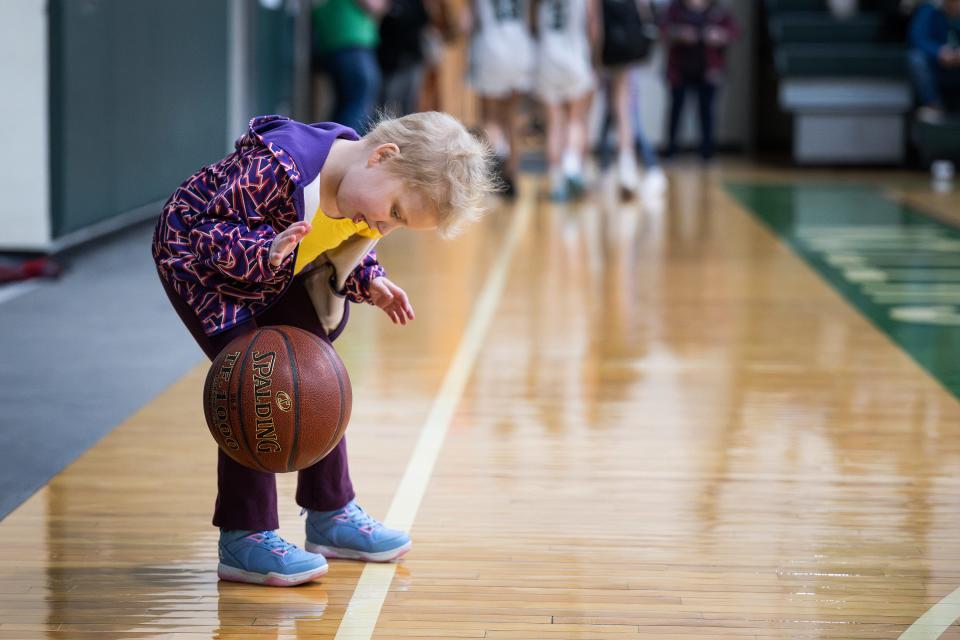 Ava Blazis, a Sutton native with acute lymphoblastic leukemia, dribbles after the first quarter of Sutton's game against Notre Dame Academy.
