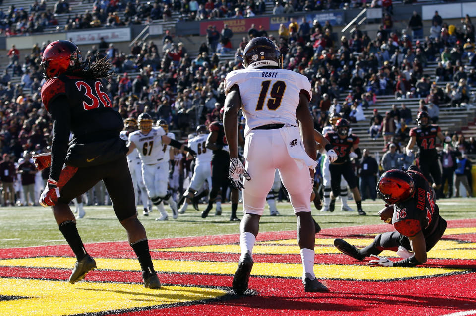 San Diego State cornerback Luq Barcoo (16) intercepts a pass intended for Central Michigan wide receiver Tyrone Scott (19) in the end zone during the first half of the New Mexico Bowl NCAA college football game on Saturday, Dec. 21, 2019 in Albuquerque, N.M. (AP Photo/Andres Leighton)