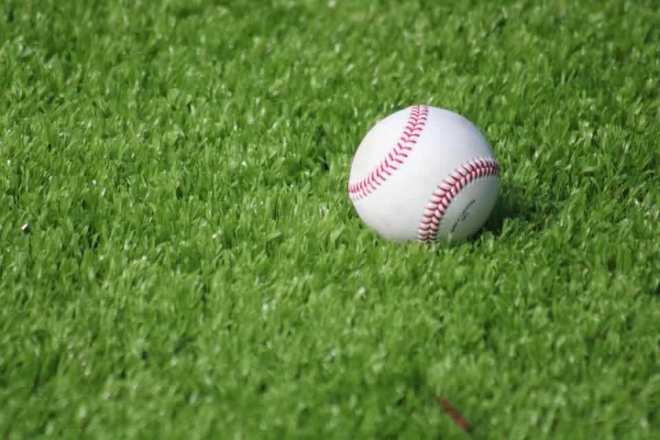 STOCK | A baseball rests on artificial turf during the High School Heritage Classic baseball game between Raines and Ribault at Fort Family Park in Jacksonville, Florida on February 15, 2024. [Clayton Freeman/Florida Times-Union]