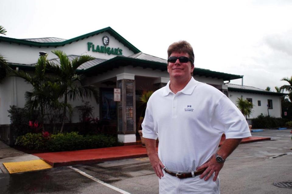 In 2005, CEO James G. Flanigan in front of Flanigan's Seafood Bar and Grill in Weston.