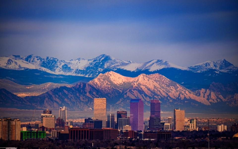 Colorado - Getty/Cityscape of downtown Denver with the Flatirons and Longs Peak in the background