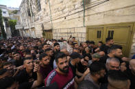 Palestinians carry the body of Islam Sabouh, who was killed during an operation by Israeli forces in the West Bank city of Nablus, Tuesday, Aug. 9, 2022. Israeli police said forces encircled the home of Ibrahim al-Nabulsi, who they say was wanted for a string of shootings in the West Bank earlier this year. They said al-Nabulsi and Sabouh, another Palestinian militant were killed in a shootout at the scene, and that troops found arms and explosives in his home. (AP Photo/Majdi Mohammed)