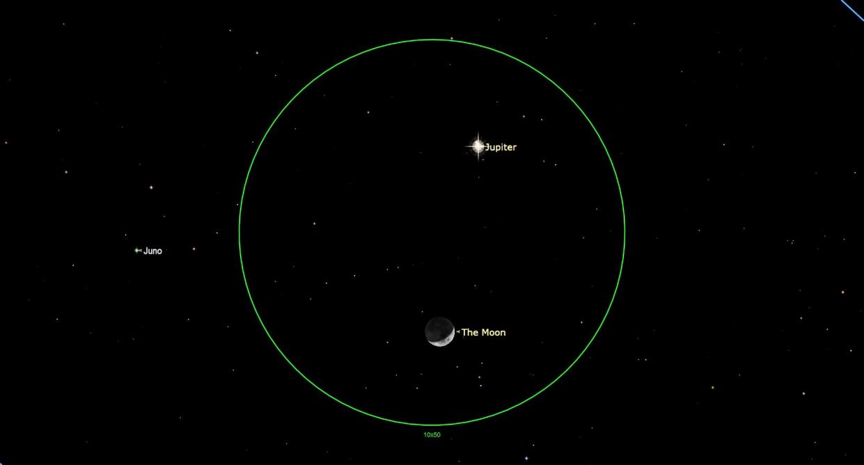  An illustration of the night sky over Earth on Wednesday, Jan. 25 when the moon and Jupiter meet in the night sky. 