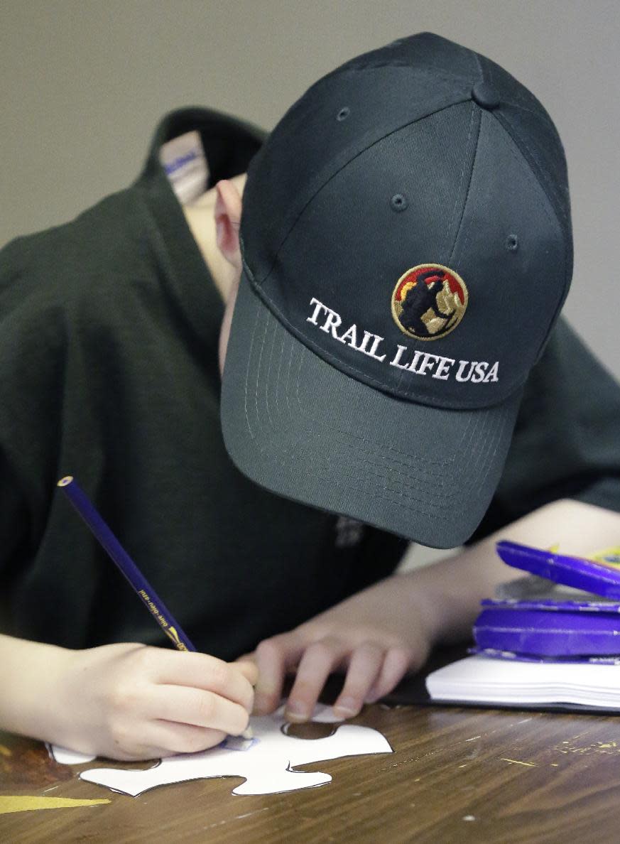 In this Tuesday, Feb. 4, 2014 photo, a Trail Life member completes a project during a meeting in North Richland Hills, Texas. Trail Life USA says it has established units in more than 40 states, mostly from Boy Scouts and parents who feel the century-old organization has lost its way. (AP Photo/LM Otero)