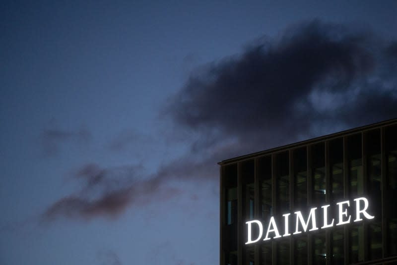 The Daimler AG logo can be seen on a facade of the company's headquarters. Marijan Murat/dpa