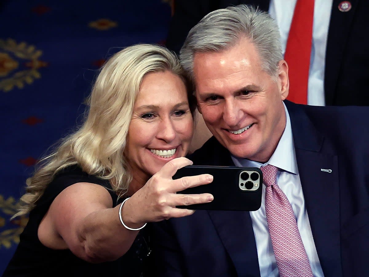 Marjorie Taylor Greene takes a photo with Kevin McCarthy after he was elected Speaker of the House in February (Getty Images)
