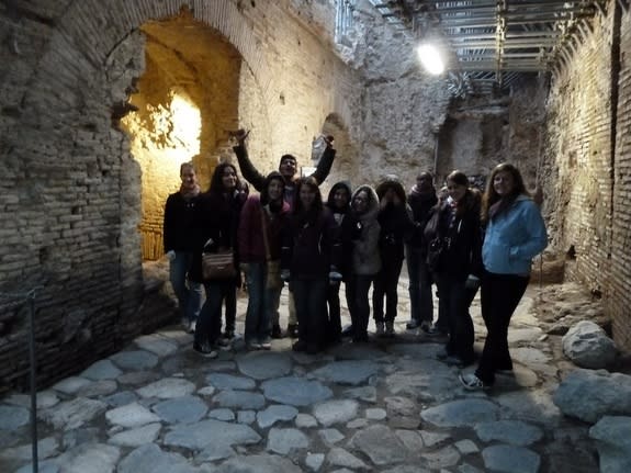 Students stand on a Roman street dating back to the 2nd century AD, now more than 15 feet (5 meters) below ground level because of the Roman tendency to build on top of old ruins. "There's a lot of Rome that is underneath now, but wasn't to sta