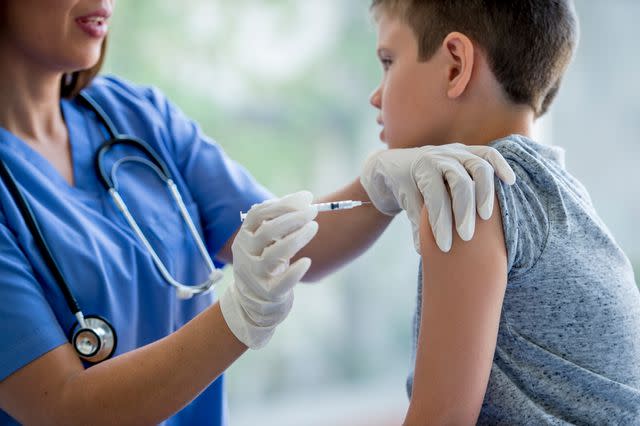 <p>Getty</p> A child gets a vaccine.