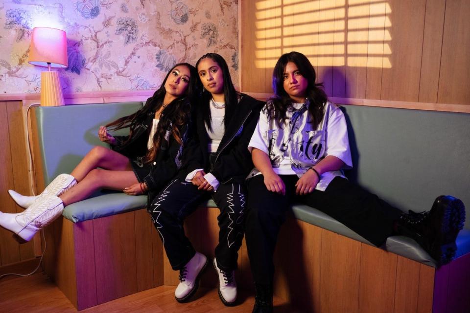 Sandra Calixto (right) Ashlee Valenzuela (middle) and Liz Trujillo make up Conexión Divina. The band plays mostly Mexican regional music and made their Coachella festival debut this year.