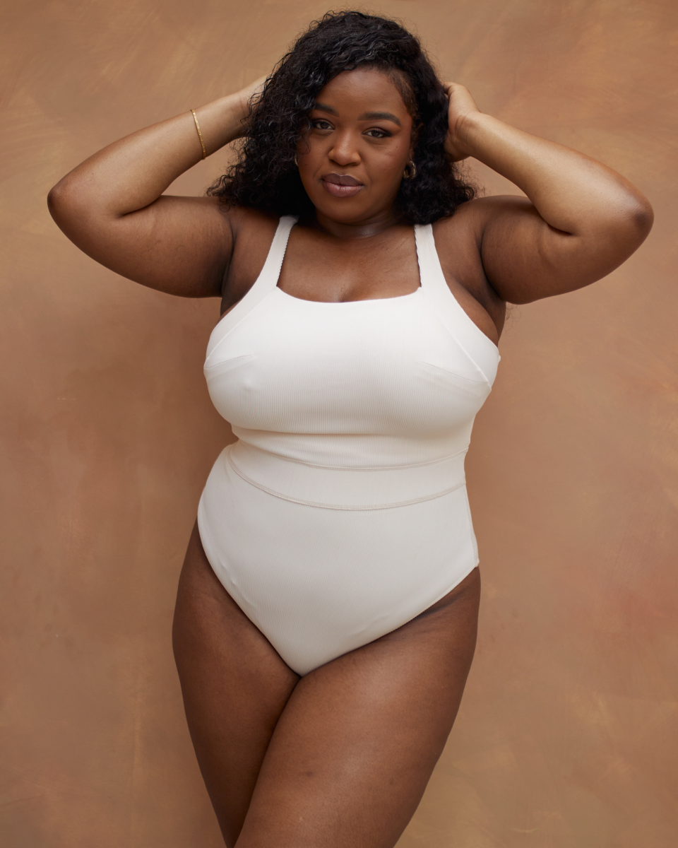 <p><a href="https://www.reign-studio.com/products/jummai-ribbed-fuller-bust-one-piece-swimsuit-off-white-1" rel="nofollow noopener" target="_blank" data-ylk="slk:Shop Now;elm:context_link;itc:0;sec:content-canvas" class="link ">Shop Now</a></p><p>Jummai Ribbed Fuller Bust Swimsuit </p><p>reign-studio.com</p><p>£42.00</p>