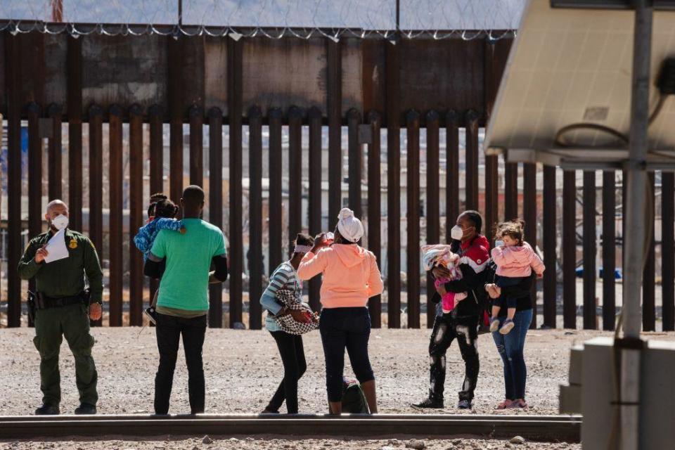 Border Patrol agents apprehend a group of migrants near downtown El Paso, Texas, on March 15, 2021. / Credit: JUSTIN HAMEL/AFP via Getty Images
