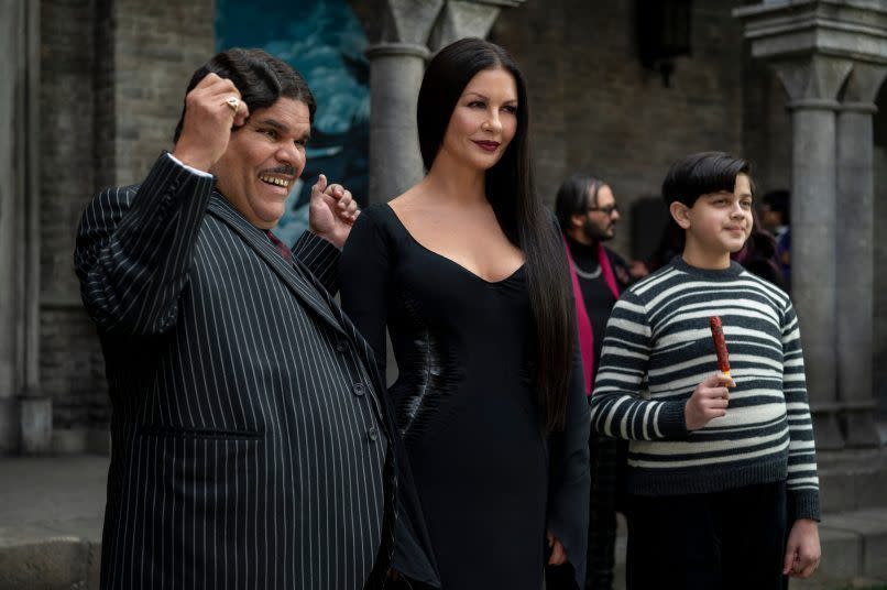 Luis Guzmán as Gomez Addams, Catherine Zeta-Jones as Morticia Addams, and Issac Ordonez as Pugsley Addams (Image credit: Netflix)