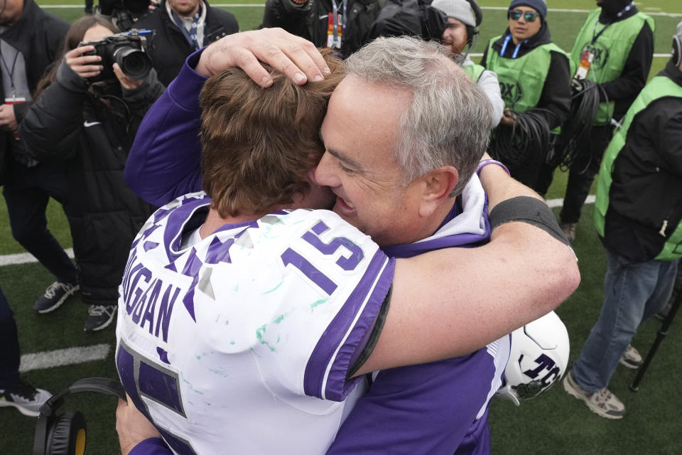 TCU head coach Sonny Dykes hugs quarterback Max Duggan (15) after an NCAA college football game against Bayor in Waco, Texas, Saturday, Nov. 19, 2022. TCU won 29-28. (AP Photo/LM Otero)