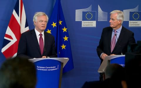 EU Chief Brexit Negotiator Michel Barnier, right, and British Secretary of State David Davis - Credit: AP