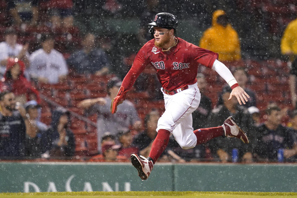 Boston Red Sox's Alex Verdugo runs home to score on a single by Xander Bogaerts during the fifth inning of the team's baseball game against the Kansas City Royals at Fenway Park, Wednesday, June 30, 2021, in Boston. (AP Photo/Elise Amendola)