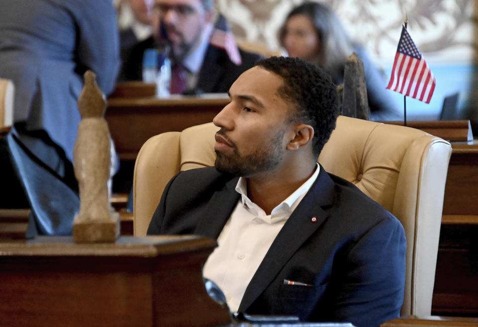 FILE- Michigan State Sen. Adam Hollier, D-Detroit, sits at his desk as the Michigan Senate considers bills in Lansing, Mich, Dec. 12, 2018. Hollier represents a majority-Black district that stretches across the northeastern edge of his economically battered and resilient hometown. That critical mass of Black voters, Hollier argues, ensures he has a chance to be elected and give voice to people who have long been ignored by the political system. (Dale G.Young/Detroit News via AP, File)