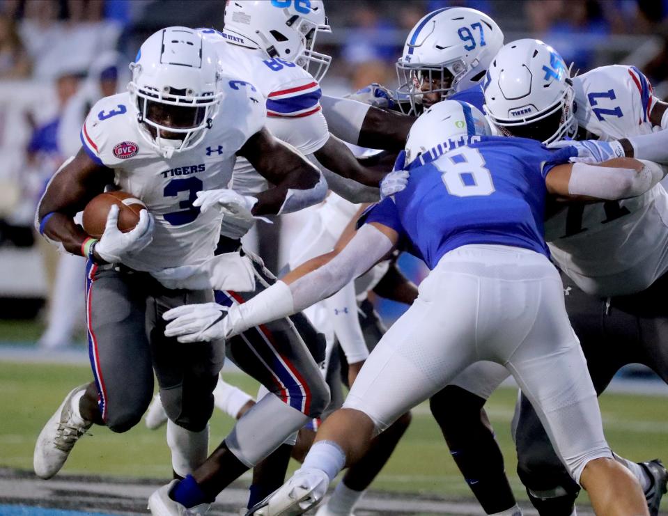 TSU running back Devon Starling (3) runs the ball as MTSU linebacker Devyn Curtis (8) moves in to try and stop him on Saturday, Sept. 17, 2022, at MTSU's home opener. 