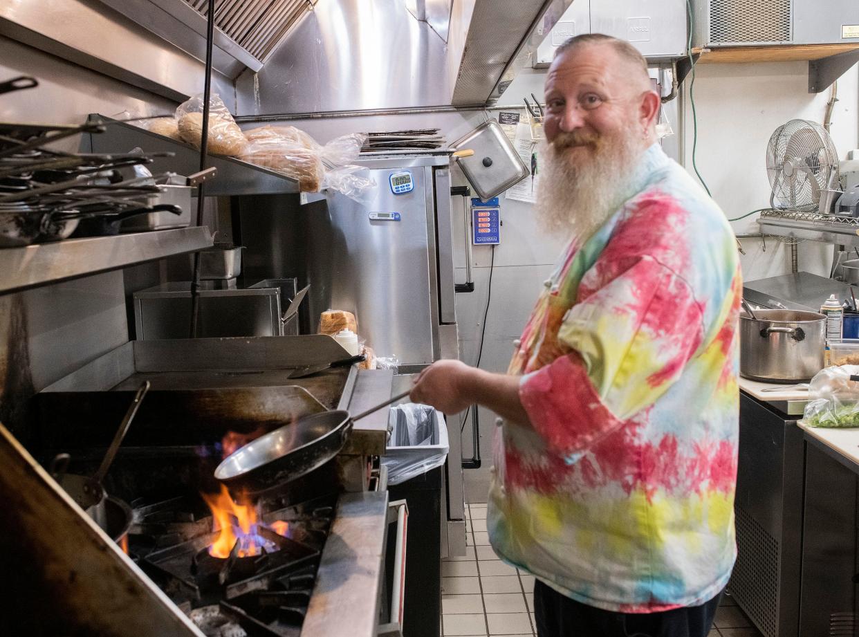 Chef Jason Brewer shows off his kitchen skills on Tuesday, March 28, 2023. Brewer is taking over the responsibilities as the culinary director of Blackwater Bistro in Milton.