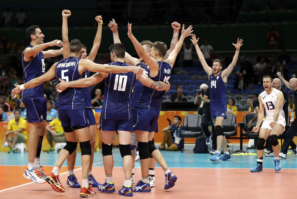 <p>Members of team Italy celebrate following a men’s preliminary volleyball match against France at the 2016 Summer Olympics in Rio de Janeiro, Brazil, Sunday, Aug. 7, 2016. Italy won in three sets. (AP Photo/Matt Rourke) </p>