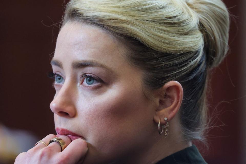 Amber Heard listens to her ex-husband’s testimony (POOL/AFP via Getty Images)