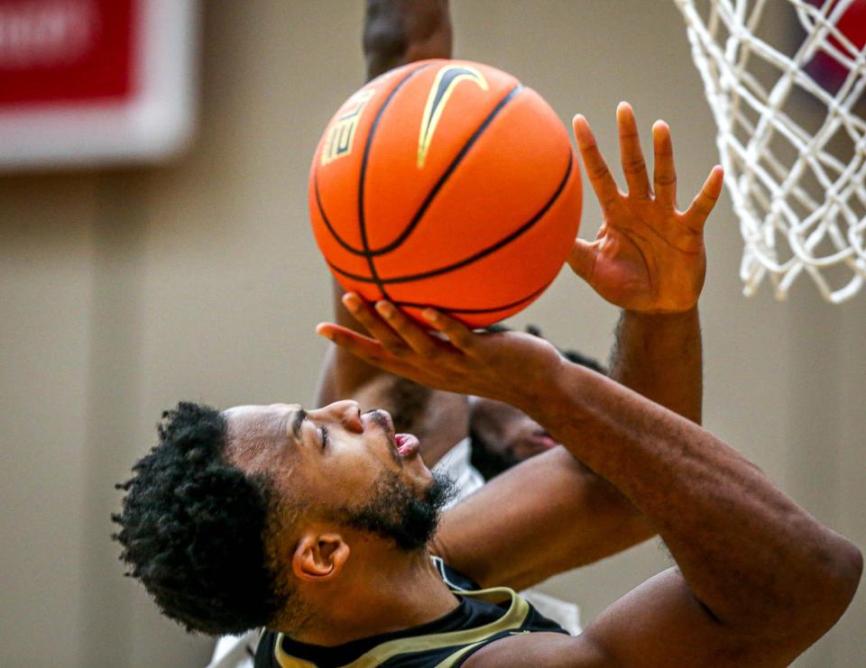 Bryant's Hall Elisias draws a foul against the Bears on Friday.