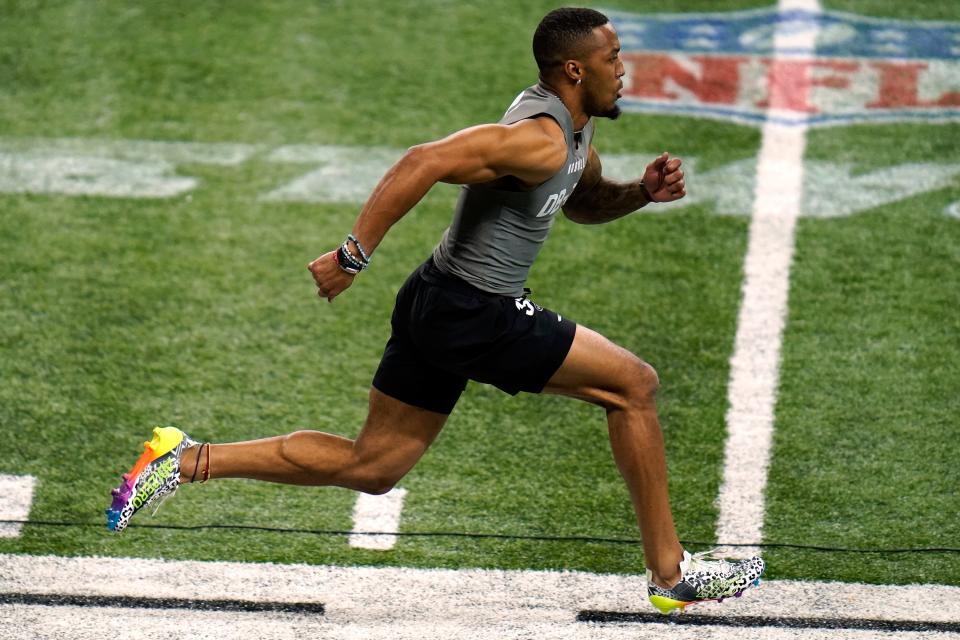 Michigan defensive back DJ Turner II runs the 40-yard dash at the NFL football scouting combine, Friday, March 3, 2023, in Indianapolis. (AP Photo Erin Hooley)