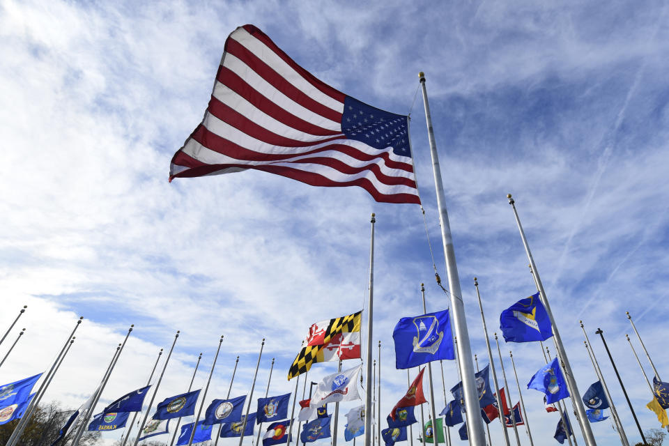 Flags fly at half-staff at Andrews Air Force Base in Md., Monday, Dec. 3, 2018, in honor of former President George H.W. Bush. An outpouring is anticipated in Washington this week during the state funeral for Bush, who died late Friday at his home in Houston. He was 94. (AP Photo/Susan Walsh)