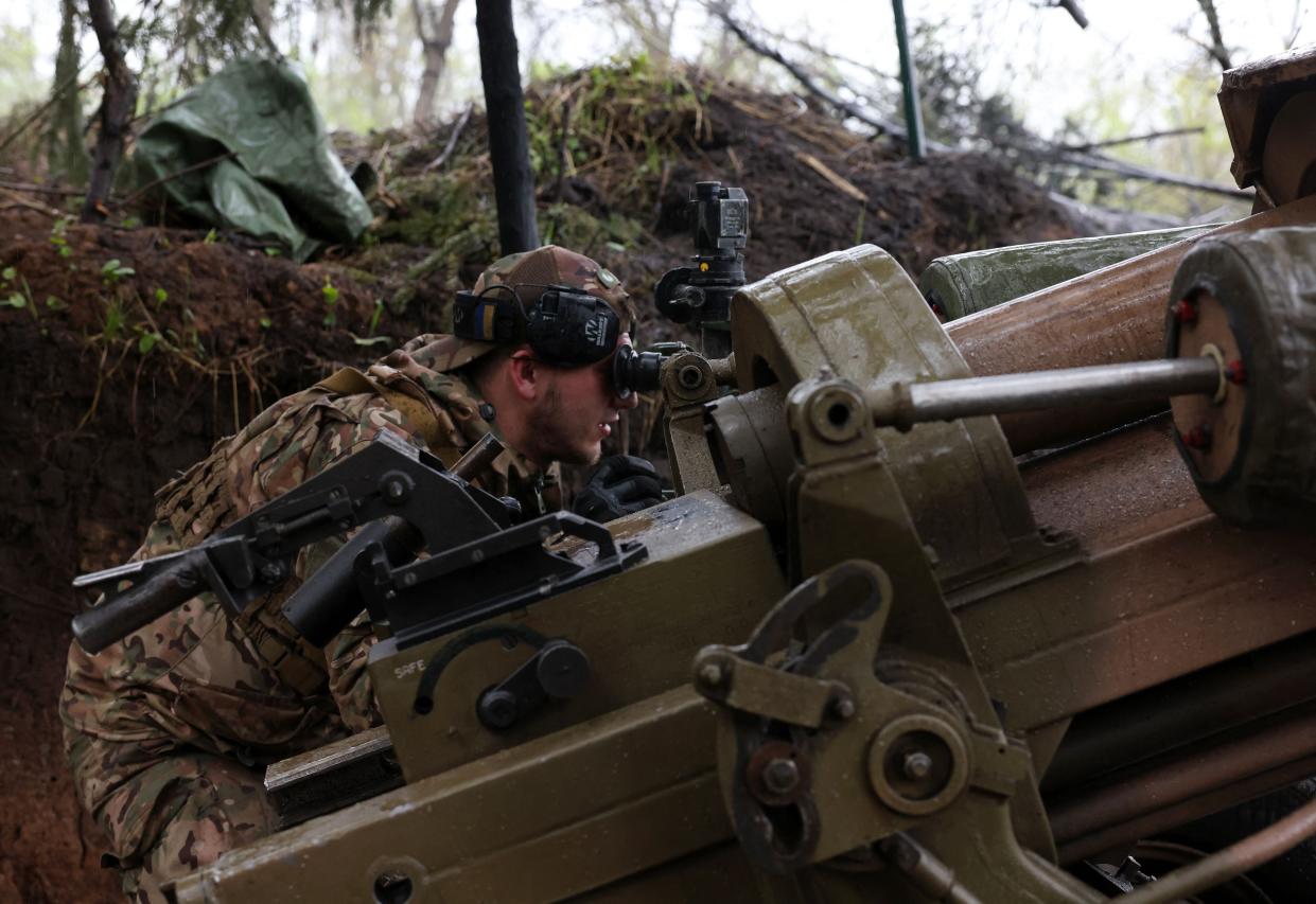 Ukrainian paratroopers fire an L119 howitzer towards Russian positions at a frontline in the Luhansk region on Thursday (AFP via Getty Images)