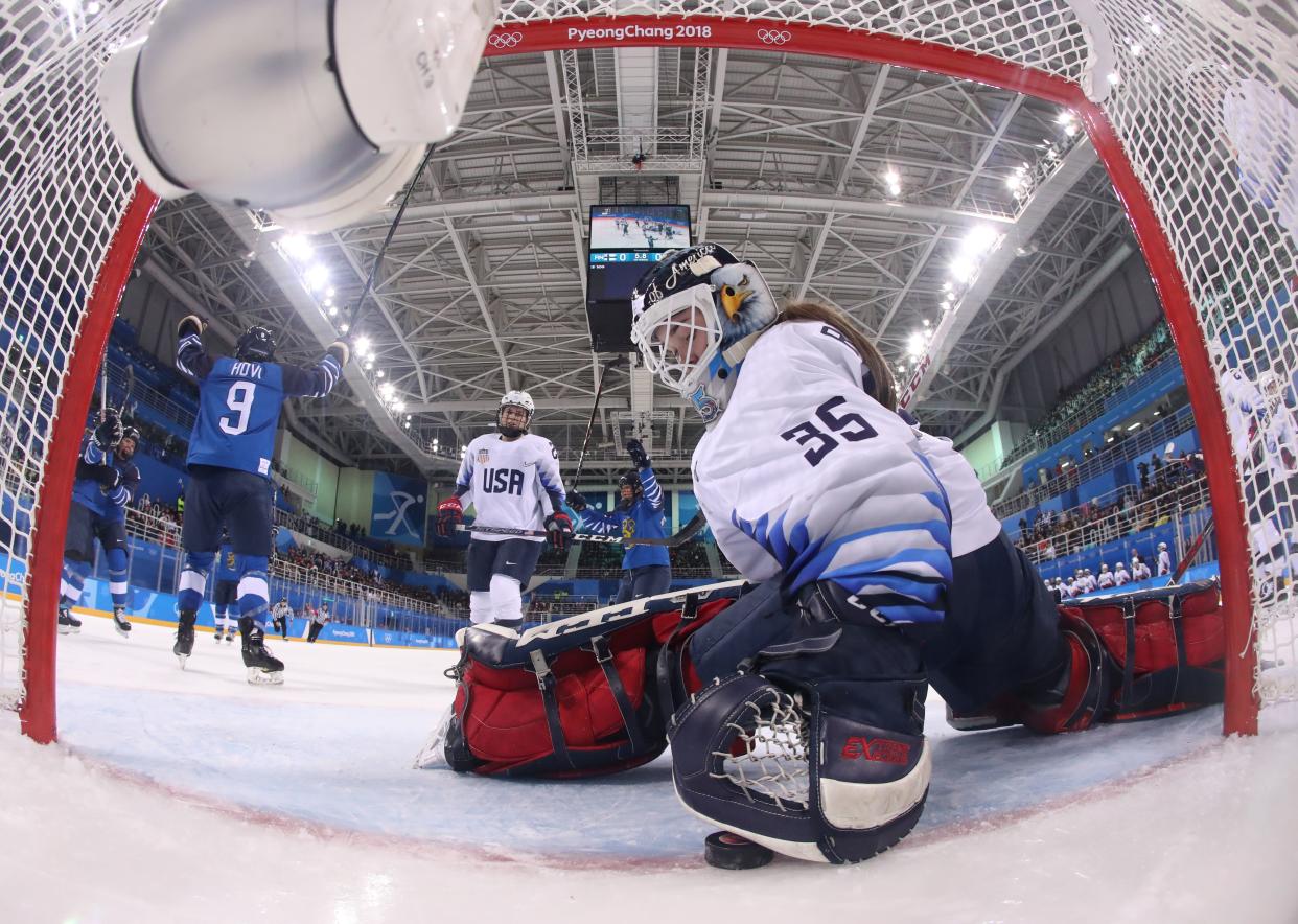 USA goaltender Madeline Rooney grabs the puck after Finland scored during the Olympic opener. (Getty)