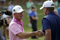 Alex Cejka, left, of Germany, shakes hands with Steve Stricker after winning on the first hole of a playoff after the final round of the PGA Tour Champions Regions Tradition golf tournament Sunday, May 9, 2021, in Hoover, Ala. (AP Photo/Butch Dill)