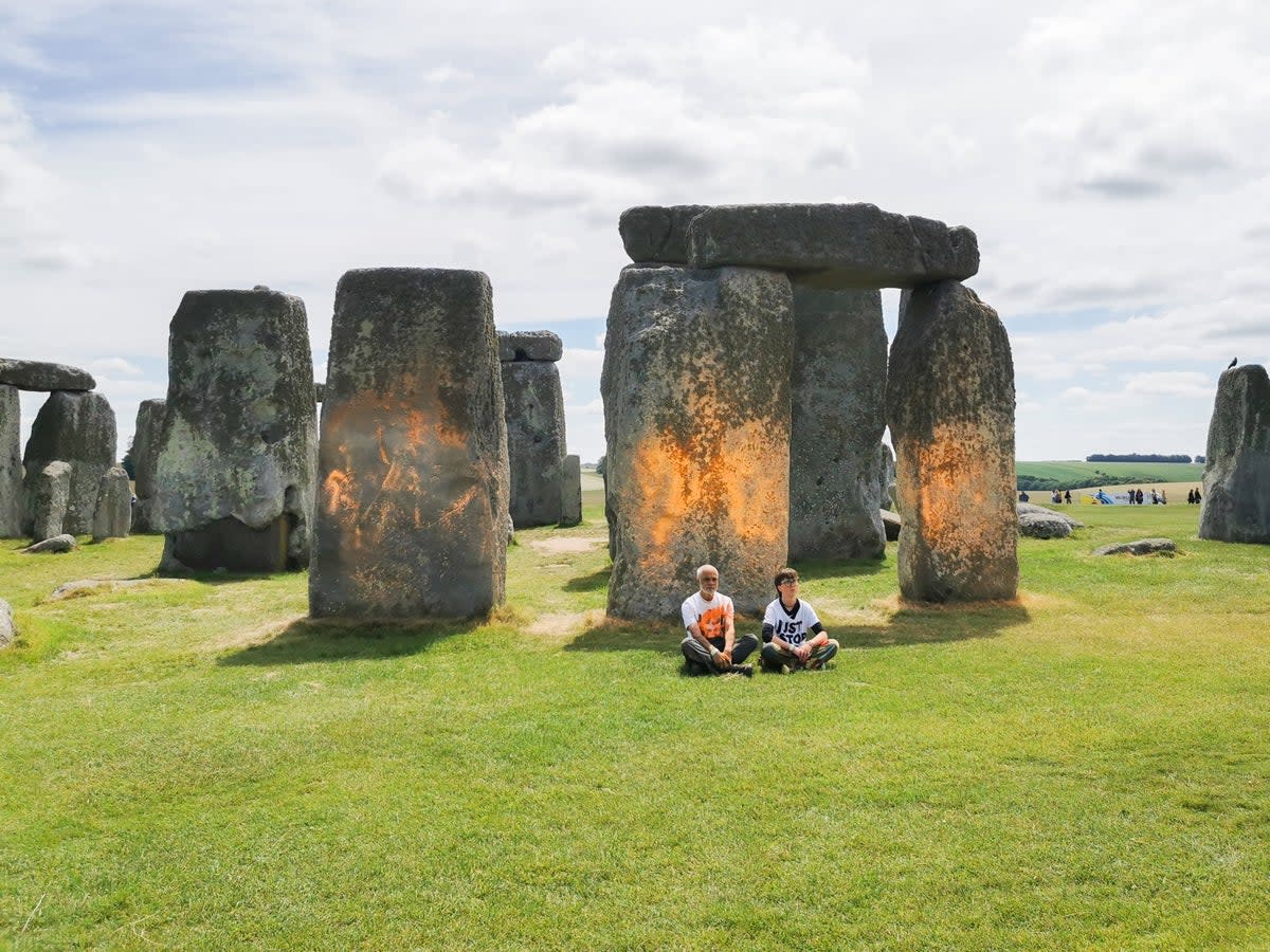 Protesters sit in front of Stonehenge (Just Stop Oil)