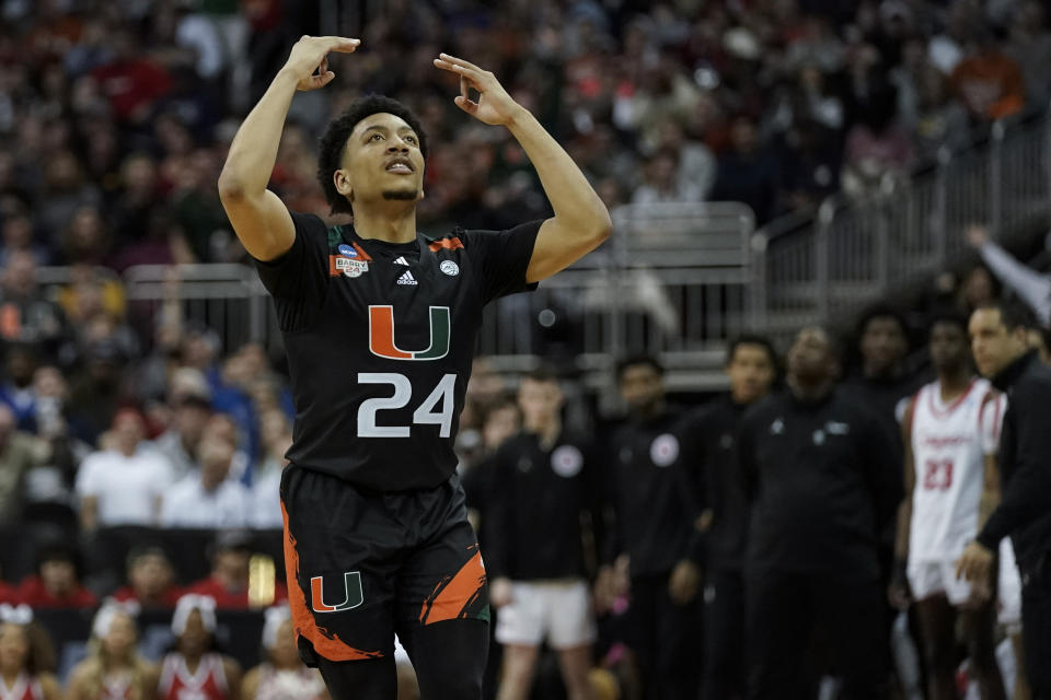 Miami guard Nijel Pack celebrates after scoring against Houston in the second half of a Sweet 16 college basketball game in the Midwest Regional of the NCAA Tournament Friday, March 24, 2023, in Kansas City, Mo. (AP Photo/Charlie Riedel)