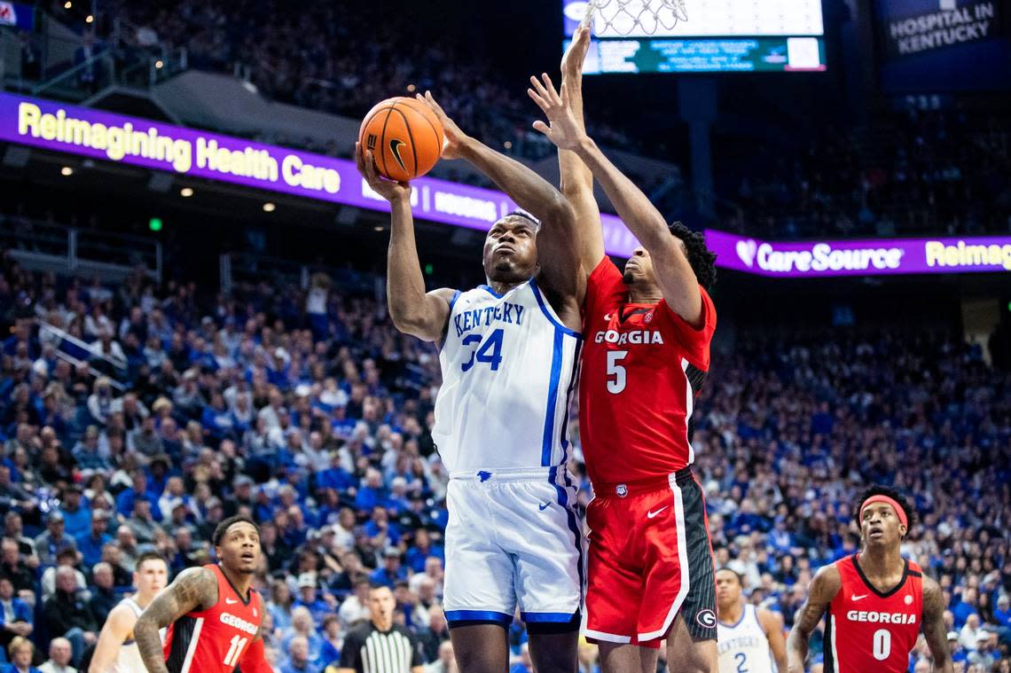 Kentucky forward Oscar Tshiebwe (34) jumps to score and draw a foul against Georgia during Tuesday’s game at Rupp Arena.