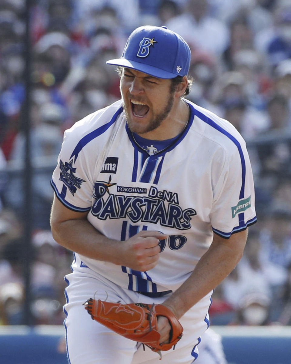 Yokohama DeNA BayStars pitcher Trevor Bauer reacts in the 7th inning of a baseball game against Hiroshima Carp in Yokohama, near Tokyo, Wednesday, May 3, 2023. After cheerleaders welcomed him, after receiving the largest ovation of any Yokohama player at the start of the game, Bauer delivered what was expected on Wednesday in his debut with the Yokohama DeNA Baystars.(Kyodo News via AP)