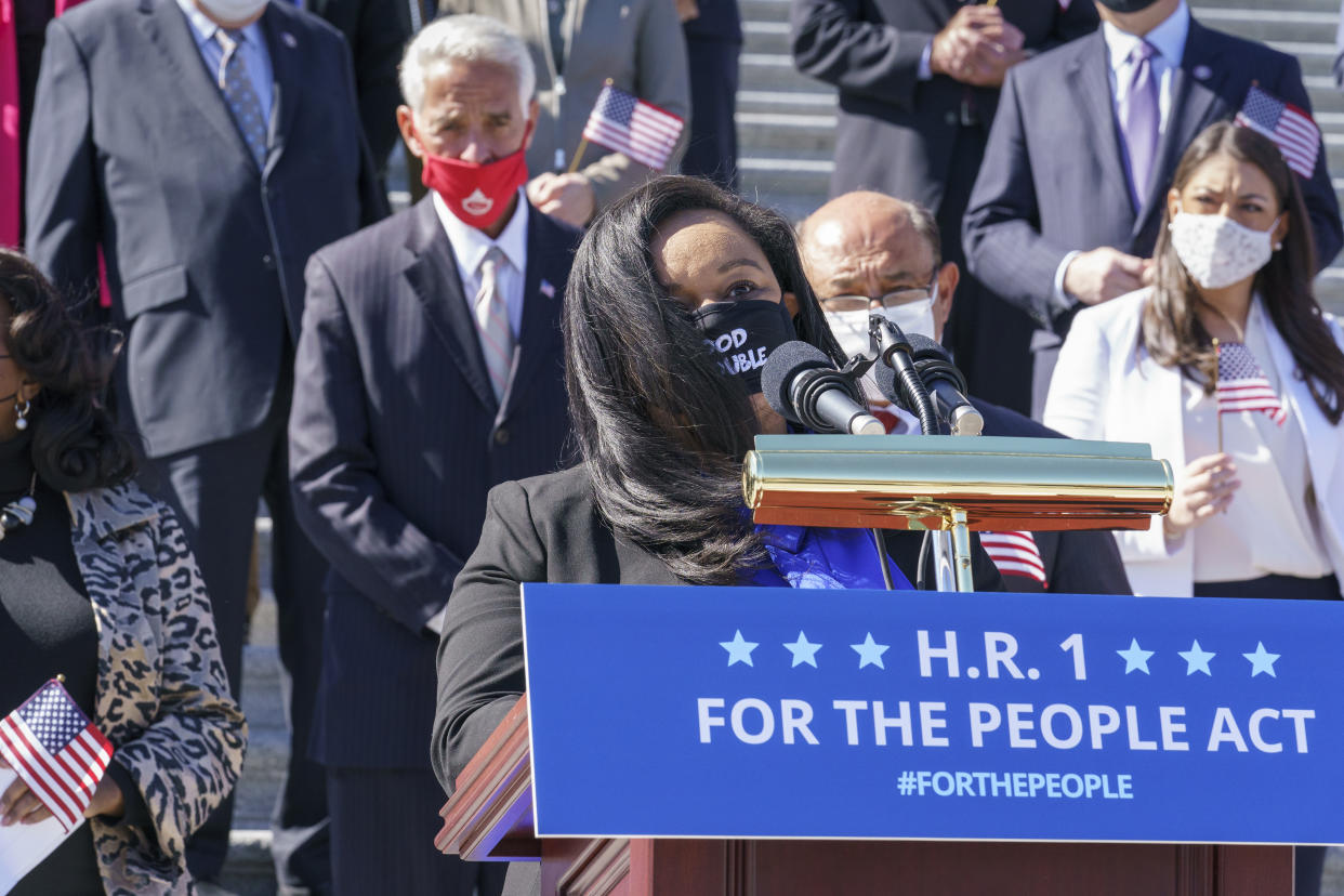 Rep. Nikema Williams, D-Ga, recalls the legacy of Rep. John Lewis as Democrats gather to address reporters on H.R. 1, the For the People Act of 2021, at the Capitol in Washington, Wednesday, March 3, 2021. House Democrats are poised to pass a sweeping elections and ethics bill, offering it up as a powerful counterweight to voting rights restrictions advancing in Republican-controlled statehouses. (AP Photo/J. Scott Applewhite)