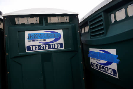 Portable restrooms near the U.S. Capitol building are seen with the company's name Don's Johns covered with tape to block the words in Washington, U.S., January 19, 2017. REUTERS/Shannon Stapleton