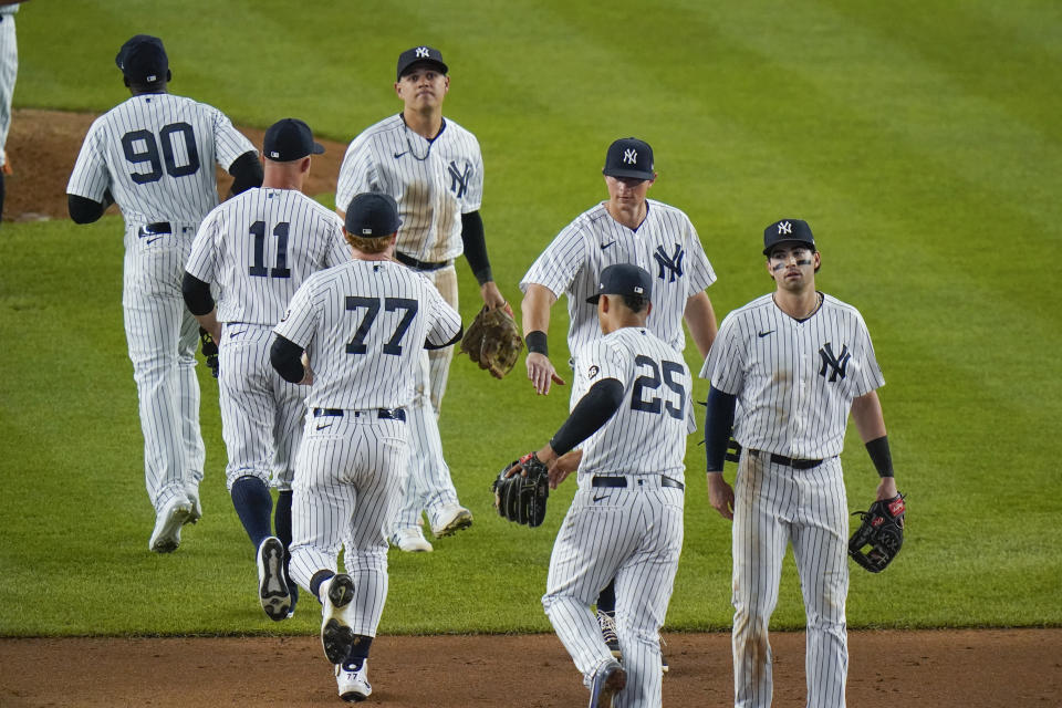 The New York Yankees celebrate their win against the Toronto Blue Jays after the second game of a baseball doubleheader Thursday, May 27, 2021, in New York. The Yankees won 5-3. (AP Photo/Frank Franklin II)