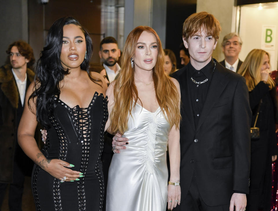 Ayesha Curry, left, Lindsay Lohan and Dakota Lohan attend a special screening of Netflix's 