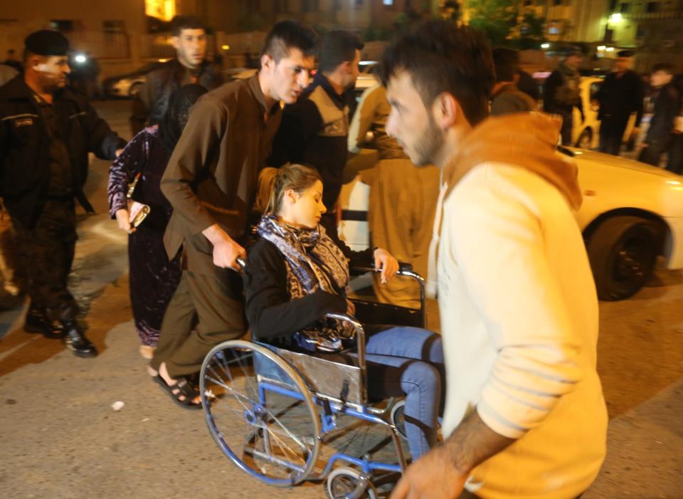 <p>A woman with a wheel chair is seen at Sulaymaniyah Hospital after a 7.2 magnitude earthquake hit northern Iraq in Sulaymaniyah, Iraq on Nov. 12, 2017. (Photo: Feriq Ferec/Anadolu Agency/Getty Images) </p>