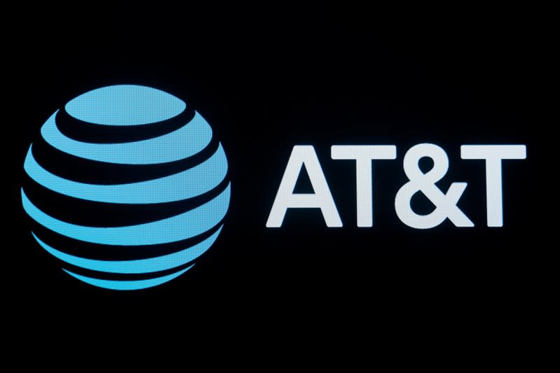 The company logo for AT&T is displayed on a screen on the floor at the New York Stock Exchange (NYSE) in New York